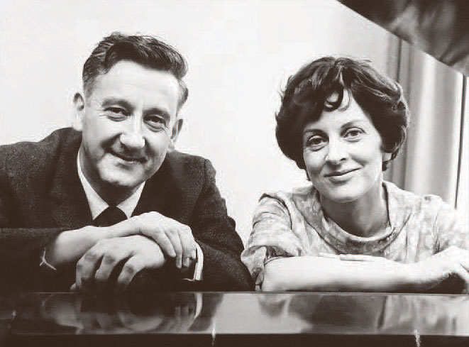 Robin and Winifred Wood at a piano in the 1970s
