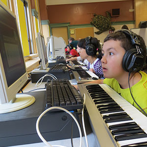 Young boy uses Children's Music Journey technology in the classroom 300x300px