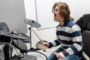 Young boy playing drums at VCM