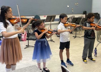 Junior Strings 2024_3 Four violin students