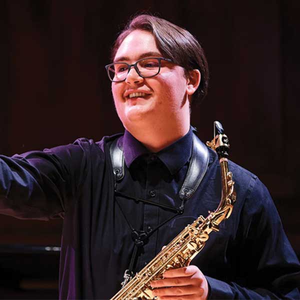 Postsecondary AIMS student performing saxophone 600px
